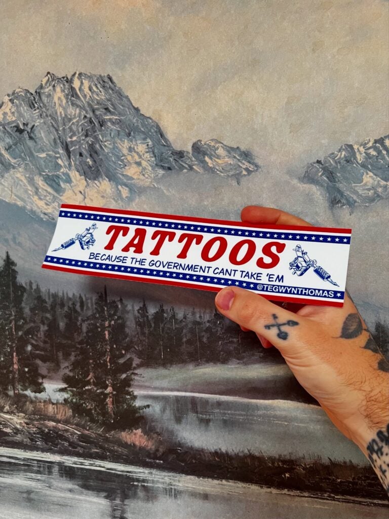 Bumper sticker with pictures of tattoo machines, and the quote says TATTOOS - Because the government can't take 'em